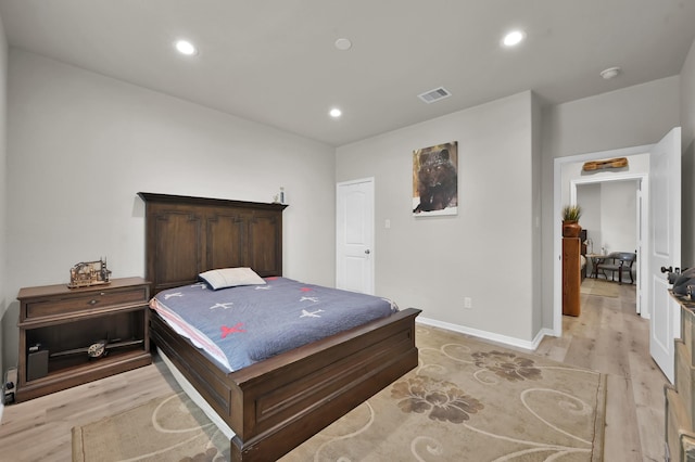 9203 White Tail Dr, Conroe, TX 77303 - bedroom with light wood-style floors and recessed lighting