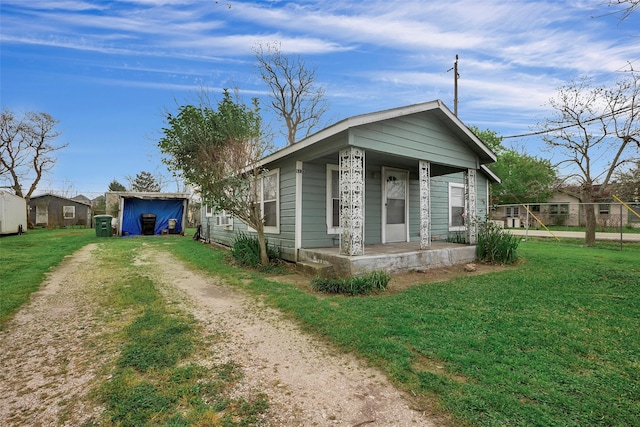 8137 Canyon St, Houston, TX 77051 - view of front of house with a porch, driveway, and a front lawn