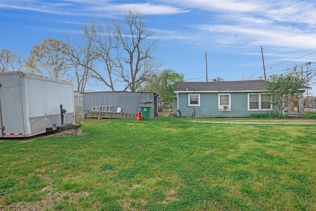 8137 Canyon St, Houston, TX 77051 - view of green lawn featuring an outbuilding