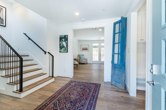 2209 Crocker St, Houston, TX 77006 - entrance foyer featuring wood finished floors, stairway, french doors, baseboards, and recessed lighting
