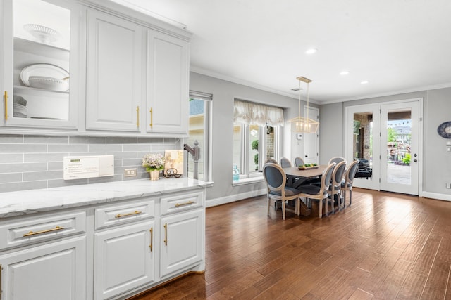 72 Tall Trl, Missouri City, TX 77459 - dining area featuring ornamental molding, healthy amount of natural light, dark wood-style flooring, and recessed lighting
