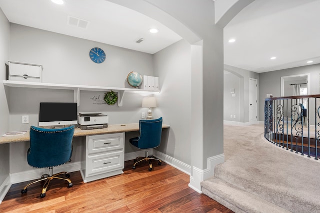 72 Tall Trl, Missouri City, TX 77459 - home office with built in study area, arched walkways, baseboards, light wood-style floors, and recessed lighting