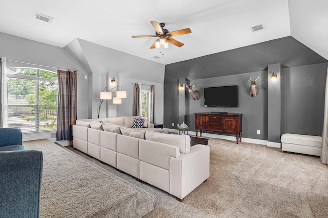 72 Tall Trl, Missouri City, TX 77459 - living room with healthy amount of natural light, carpet floors, ceiling fan, vaulted ceiling, and baseboards