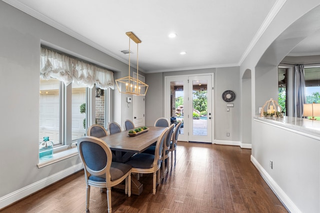 72 Tall Trl, Missouri City, TX 77459 - dining area with a chandelier, dark wood finished floors, baseboards, arched walkways, and recessed lighting