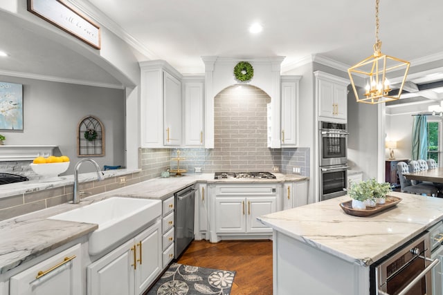 72 Tall Trl, Missouri City, TX 77459 - kitchen with stainless steel appliances, tasteful backsplash, white cabinets, dark wood-style floors, and ornamental molding