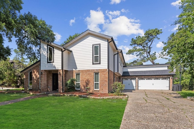 20407 Spoonwood Dr, Humble, TX 77346 - view of front of property with brick siding, a garage, asphalt driveway, and a front lawn