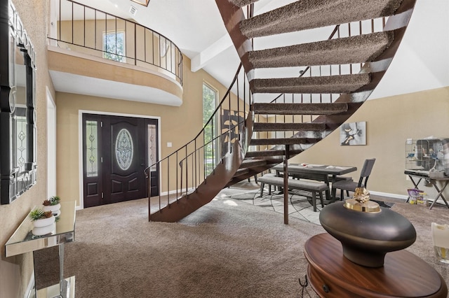 20407 Spoonwood Dr, Humble, TX 77346 - carpeted entrance foyer with a high ceiling, stairway, and baseboards