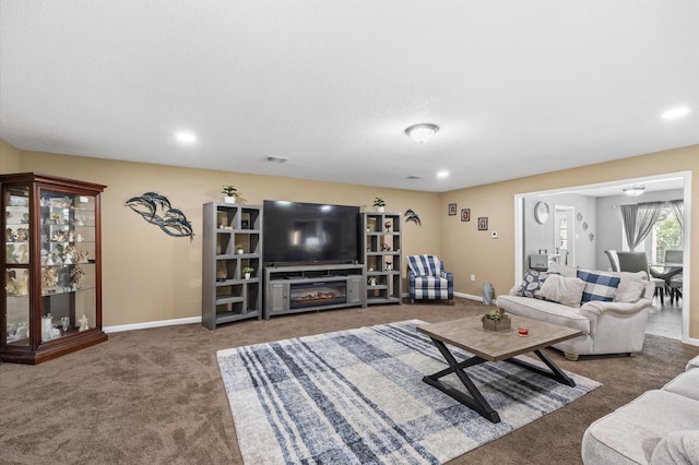 20407 Spoonwood Dr, Humble, TX 77346 - carpeted living room featuring baseboards and recessed lighting