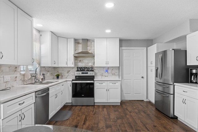 20407 Spoonwood Dr, Humble, TX 77346 - kitchen with appliances with stainless steel finishes, wall chimney range hood, a textured ceiling, decorative backsplash, and white cabinets