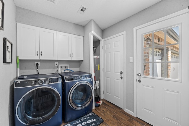 20407 Spoonwood Dr, Humble, TX 77346 - laundry area with washing machine and dryer, dark wood-style floors, cabinet space, water heater, and baseboards