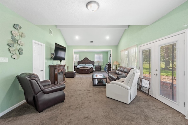 20407 Spoonwood Dr, Humble, TX 77346 - carpeted living area featuring french doors, a fireplace, and baseboards