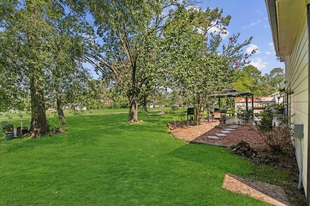 20407 Spoonwood Dr, Humble, TX 77346 - view of green lawn featuring a gazebo and a patio area