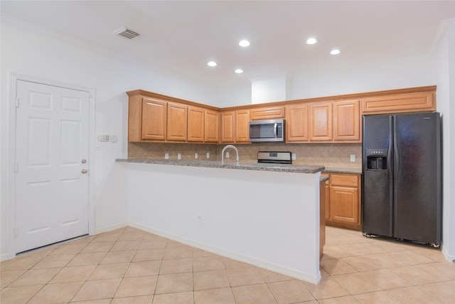 5413 Kiam St Unit B, Houston, TX 77007 - kitchen featuring appliances with stainless steel finishes, tasteful backsplash, light tile patterned flooring, ornamental molding, and recessed lighting