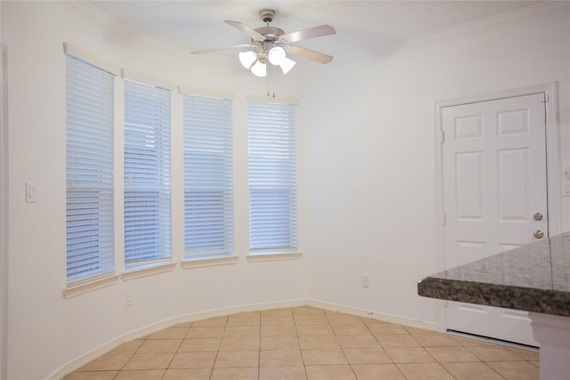 5413 Kiam St Unit B, Houston, TX 77007 - unfurnished dining area with a ceiling fan, ornamental molding, light tile patterned floors, and baseboards