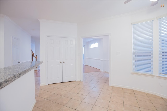 5413 Kiam St Unit B, Houston, TX 77007 - empty room with crown molding, light tile patterned floors, ceiling fan, baseboards, and stairs