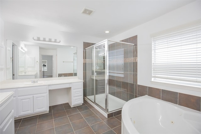 5413 Kiam St Unit B, Houston, TX 77007 - bathroom with vanity, a whirlpool tub, a stall shower, tile patterned flooring, and recessed lighting