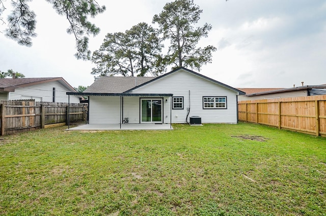 14934 Arundel Dr, Channelview, TX 77530 - back of property featuring a patio area and central AC