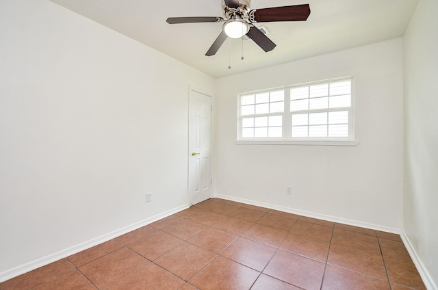 14934 Arundel Dr, Channelview, TX 77530 - empty room with tile patterned floors, baseboards, and ceiling fan