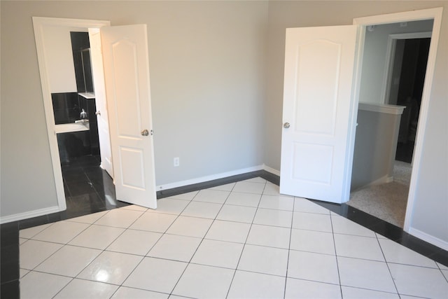 12002 Cobbs Creek Ct, Houston, TX 77067 - unfurnished bedroom featuring baseboards and light tile patterned floors