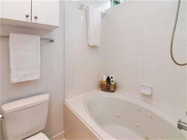 1508 Cleveland St, Houston, TX 77019 - bathroom with toilet and a combined bath / shower with jetted tub