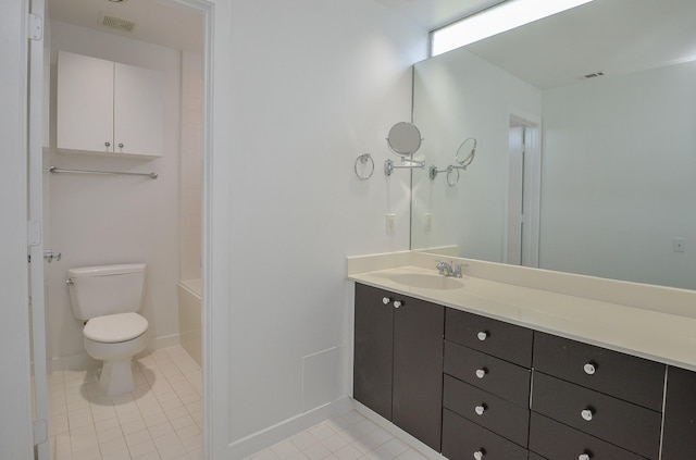 1508 Cleveland St, Houston, TX 77019 - bathroom with toilet, vanity, tile patterned flooring, and baseboards