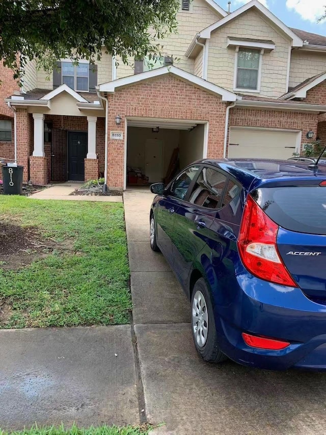 8110 Singing Sonnet Ln, Houston, TX 77072 - view of home's exterior with brick siding and a garage