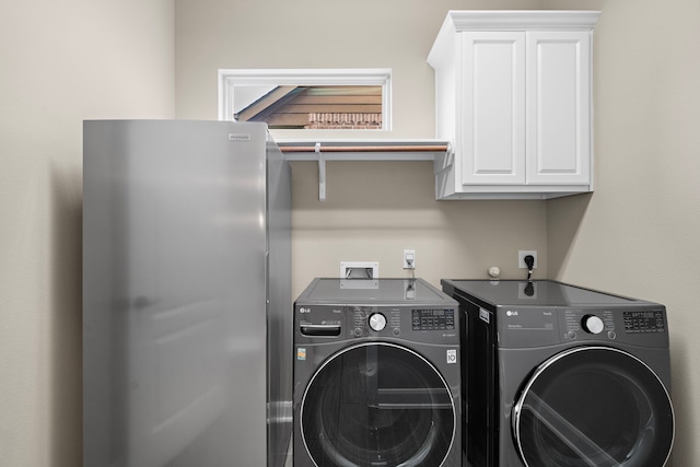 2506 Haven Hill Dr, Katy, TX 77494 - washroom with washer and clothes dryer and cabinet space