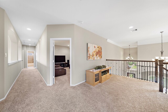 2506 Haven Hill Dr, Katy, TX 77494 - hall featuring attic access, carpet, a chandelier, baseboards, and recessed lighting