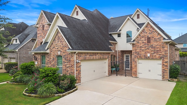 2506 Haven Hill Dr, Katy, TX 77494 - view of front facade with roof with shingles, stucco siding, brick siding, and driveway
