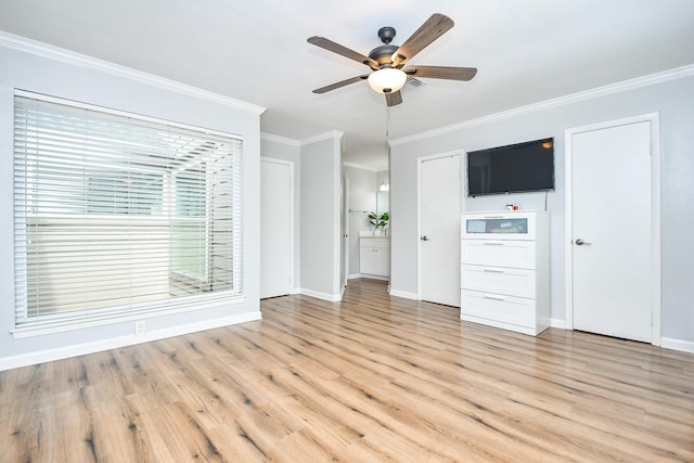 1908 Augusta Dr Unit 10, Houston, TX 77057 - unfurnished living room featuring a ceiling fan, crown molding, light wood finished floors, and baseboards