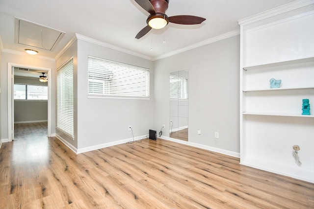 1908 Augusta Dr Unit 10, Houston, TX 77057 - spare room with attic access, a ceiling fan, ornamental molding, baseboards, and light wood-style flooring