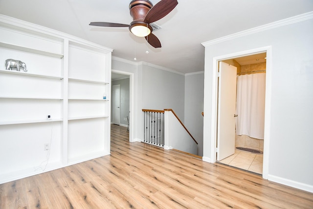 1908 Augusta Dr Unit 10, Houston, TX 77057 - empty room with light wood finished floors, ceiling fan, crown molding, and baseboards