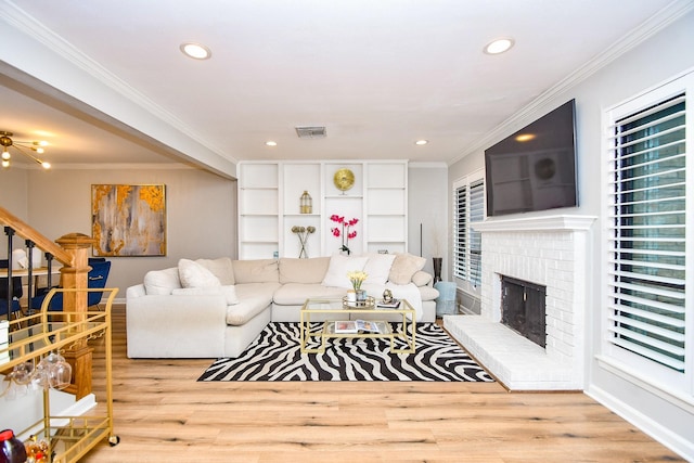 1908 Augusta Dr Unit 10, Houston, TX 77057 - living area with a fireplace, wood finished floors, recessed lighting, stairway, and crown molding
