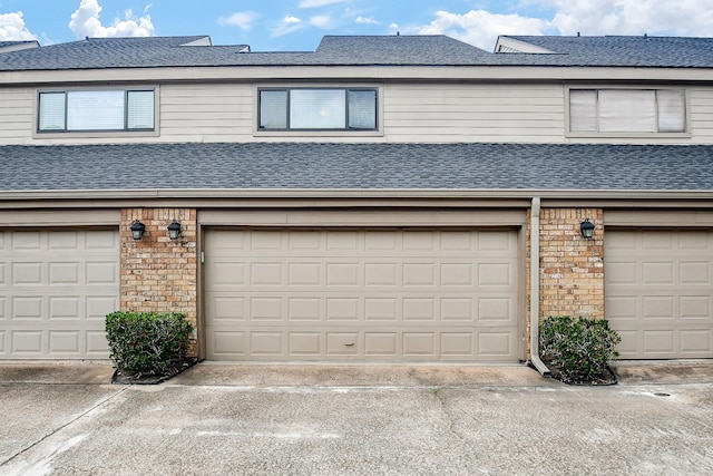 1908 Augusta Dr Unit 10, Houston, TX 77057 - view of front of house with brick siding and a shingled roof