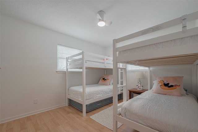 22023 Deaf P Smith Dr, Galveston, TX 77554 - bedroom featuring light wood finished floors and ceiling fan