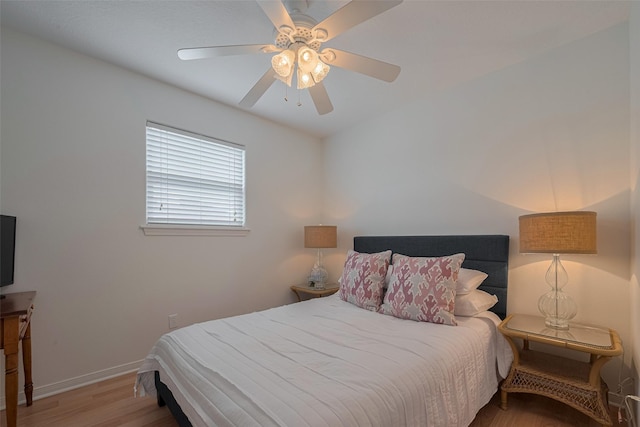 22023 Deaf P Smith Dr, Galveston, TX 77554 - bedroom featuring wood finished floors and a ceiling fan