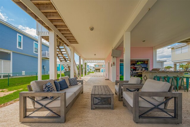 22023 Deaf P Smith Dr, Galveston, TX 77554 - view of patio featuring an outdoor living space