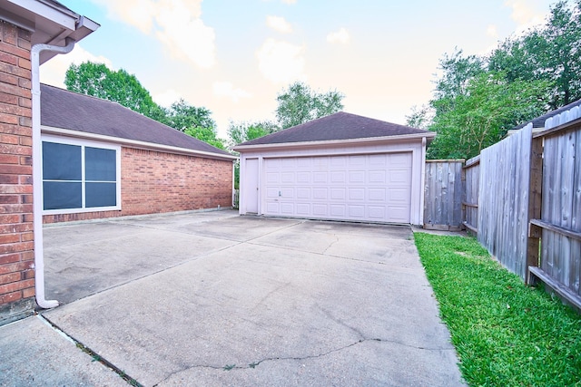 5022 Moss Run Dr, Missouri City, TX 77459 - garage at dusk featuring a detached garage
