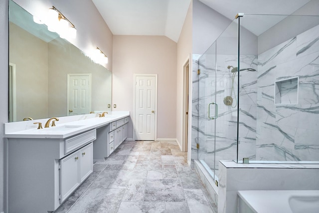 5022 Moss Run Dr, Missouri City, TX 77459 - full bathroom with double vanity, a marble finish shower, baseboards, lofted ceiling, and stone finish floors