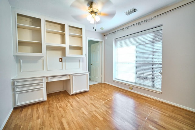 5022 Moss Run Dr, Missouri City, TX 77459 - unfurnished office featuring a ceiling fan, built in study area, baseboards, and light wood finished floors