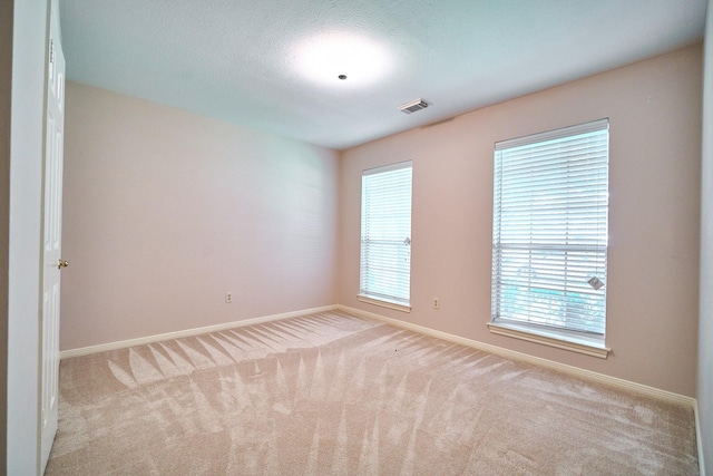 5022 Moss Run Dr, Missouri City, TX 77459 - carpeted empty room with baseboards