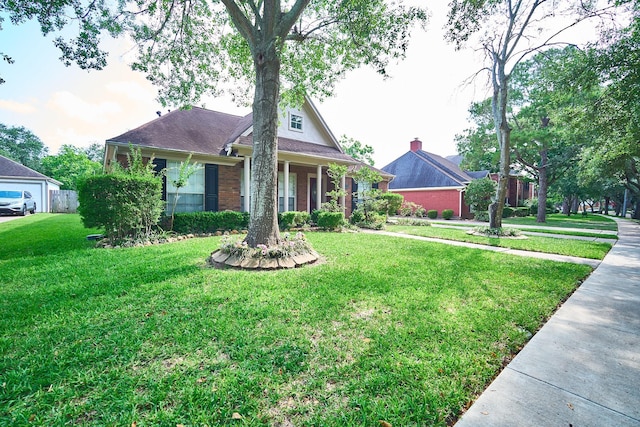 5022 Moss Run Dr, Missouri City, TX 77459 - view of front of house with a front yard and brick siding
