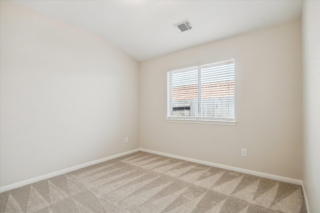 5023 Birch Manor Ln, Katy, TX 77494 - spare room with light carpet, baseboards, and lofted ceiling