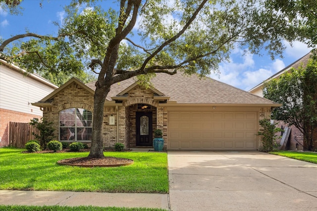 5023 Birch Manor Ln, Katy, TX 77494 - view of front of property with an attached garage, roof with shingles, driveway, stone siding, and brick siding