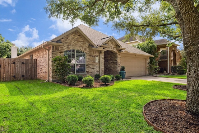 5023 Birch Manor Ln, Katy, TX 77494 - view of front of home with brick siding, a garage, driveway, and a shingled roof