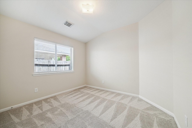 5023 Birch Manor Ln, Katy, TX 77494 - spare room featuring light colored carpet, baseboards, and vaulted ceiling