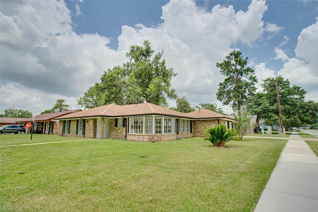29302 Raestone St, Spring, TX 77386 - ranch-style home featuring a front lawn and brick siding