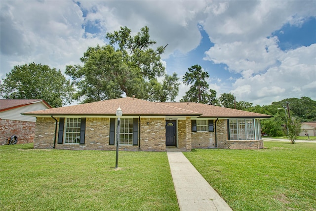 29302 Raestone St, Spring, TX 77386 - ranch-style home featuring a front lawn, brick siding, and a shingled roof