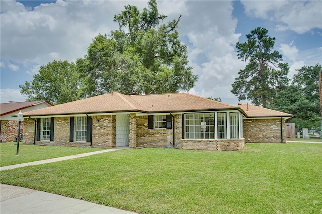 29302 Raestone St, Spring, TX 77386 - ranch-style house featuring a front lawn, brick siding, and a shingled roof