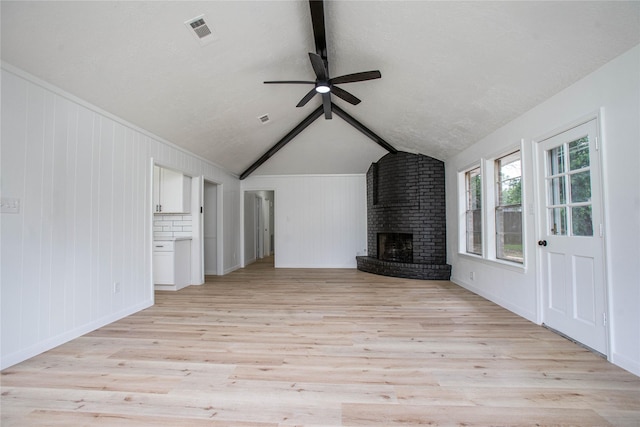 29302 Raestone St, Spring, TX 77386 - unfurnished living room with a ceiling fan, light wood finished floors, and a brick fireplace